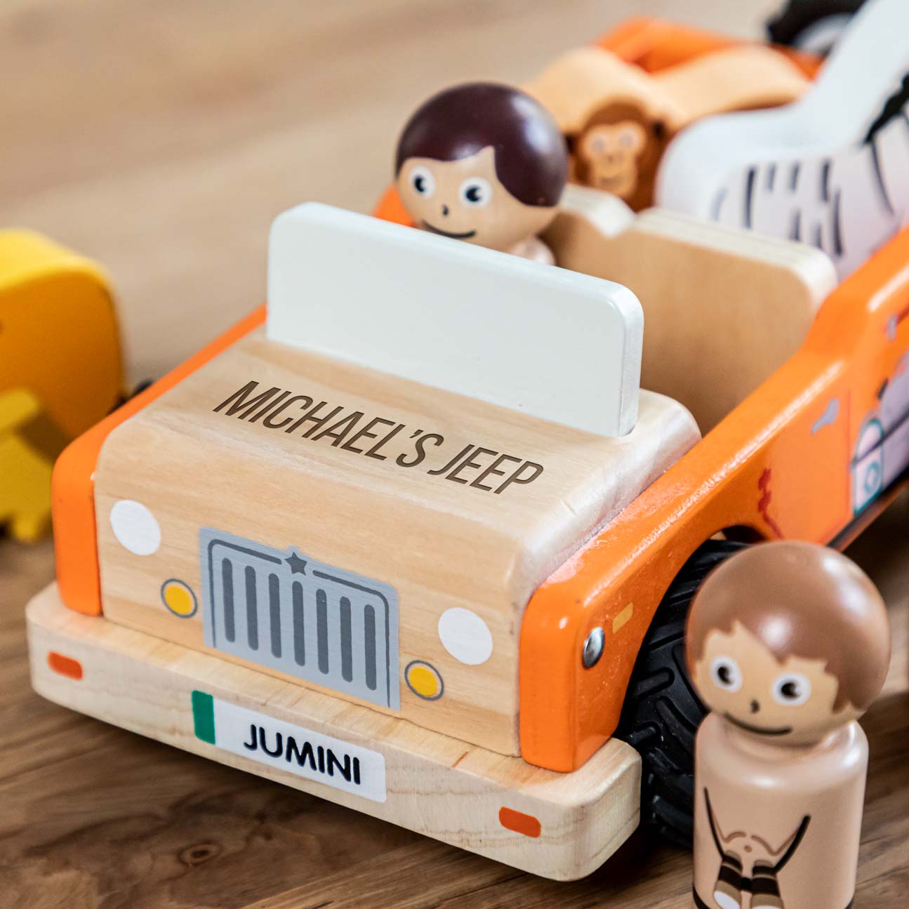 Close up of personalisation on wooden toy jeep