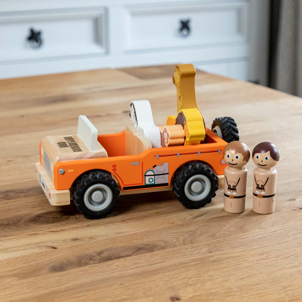 Side view of jungle jeep toy with animals play set