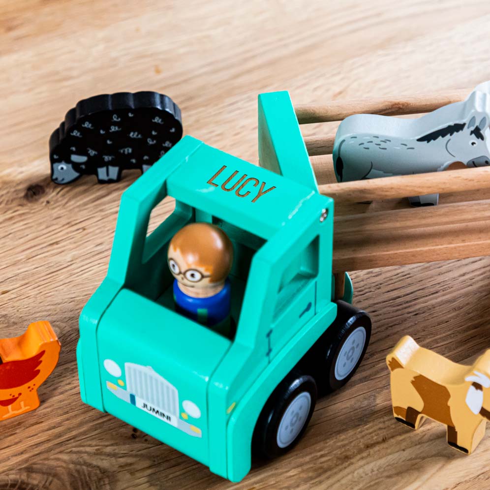 Close up of personalised name on wooden farm lorry toy