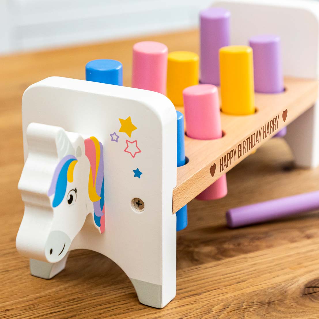 Close up of unicorn hammer bench toy