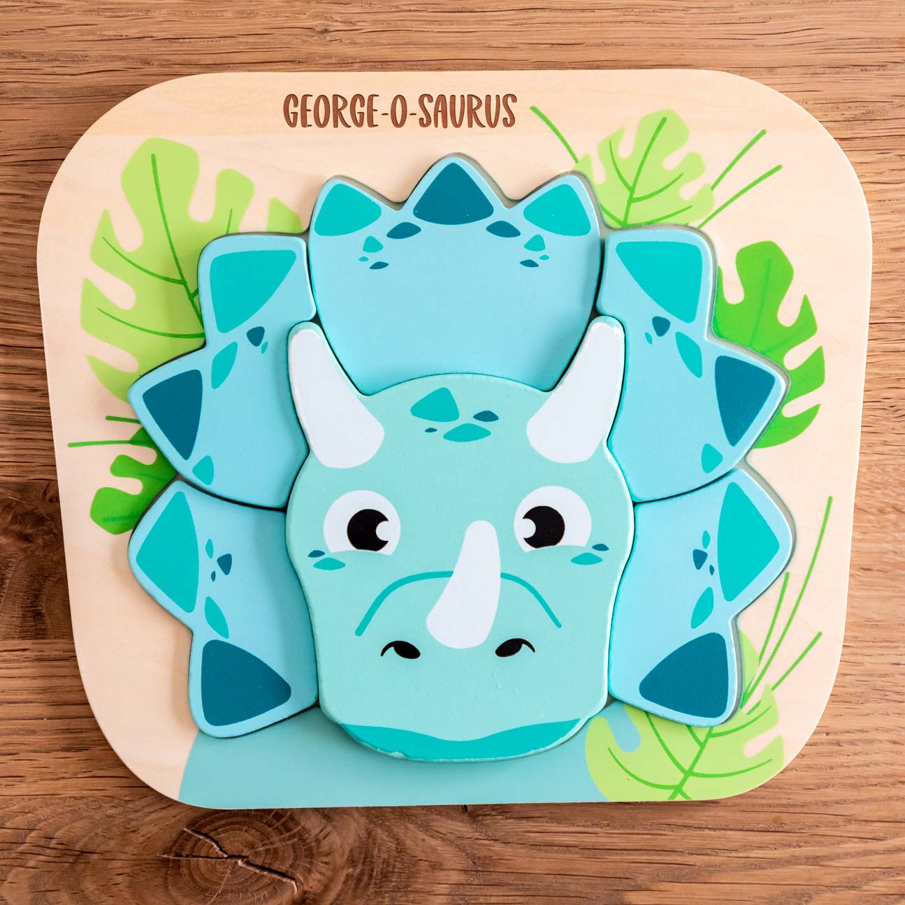 Personalised wooden puzzle with triceratops dinosaur design