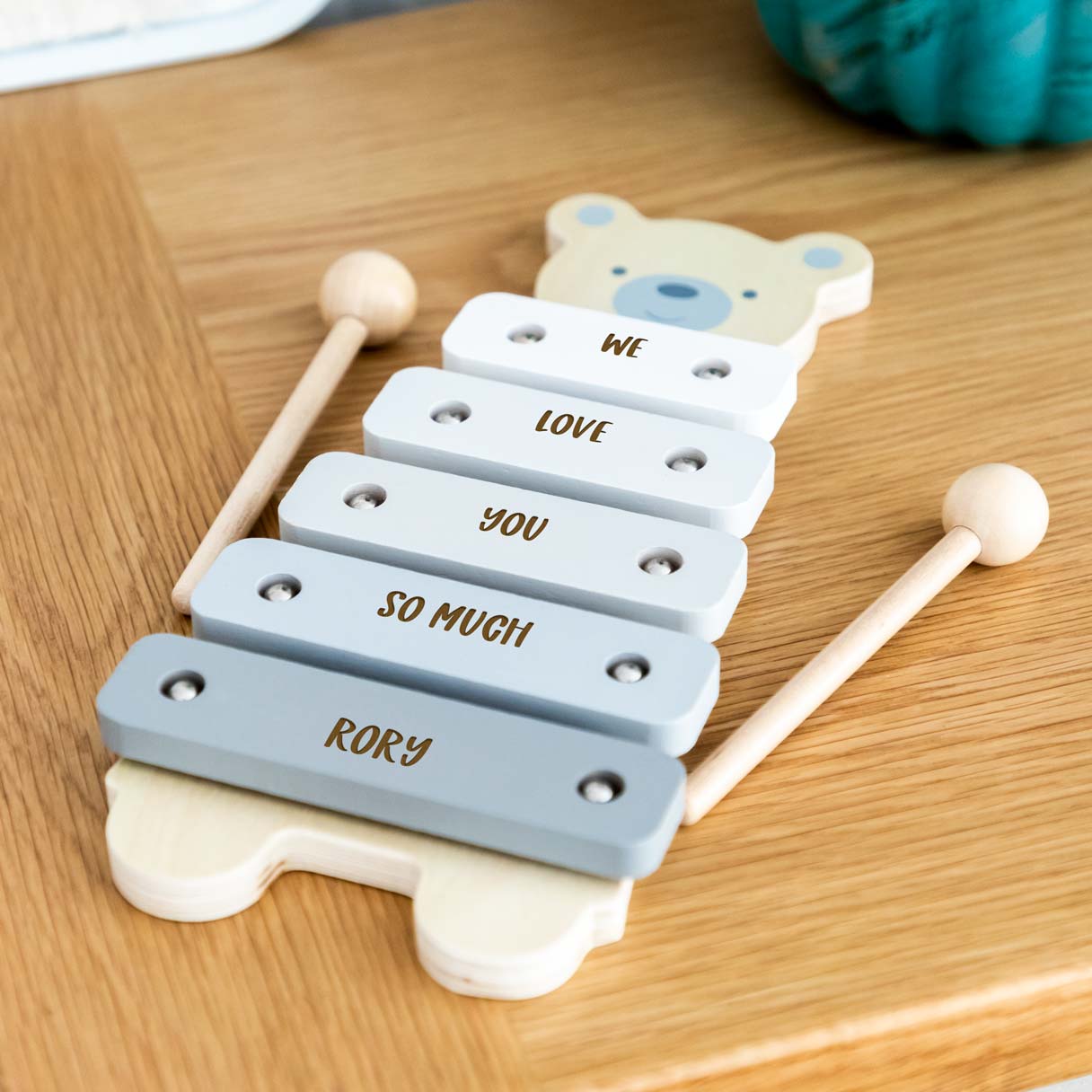 Close up of personalisation on wooden bear xylophone toy