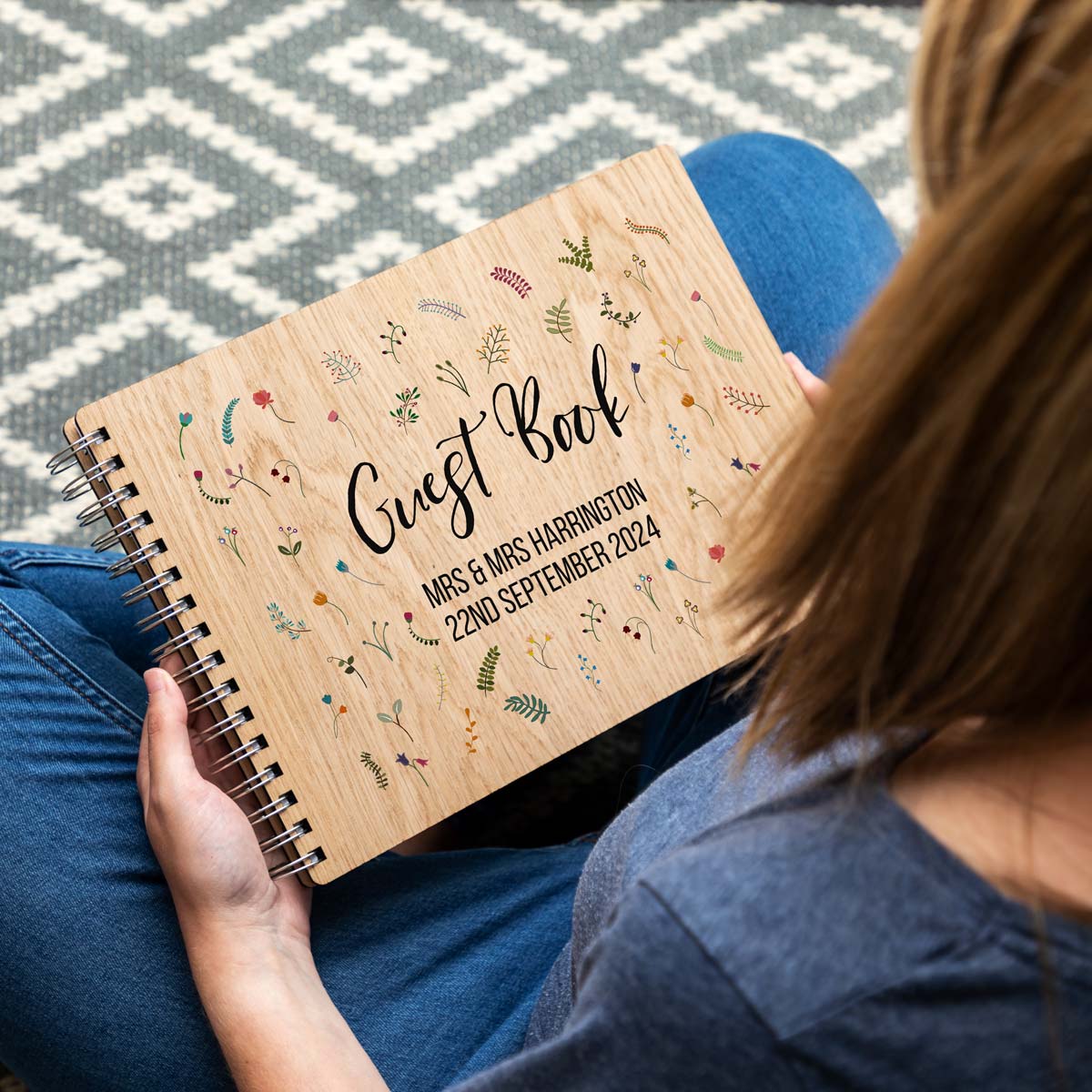 A4 landscape wedding guest book with personalised names and date with a wildflower design