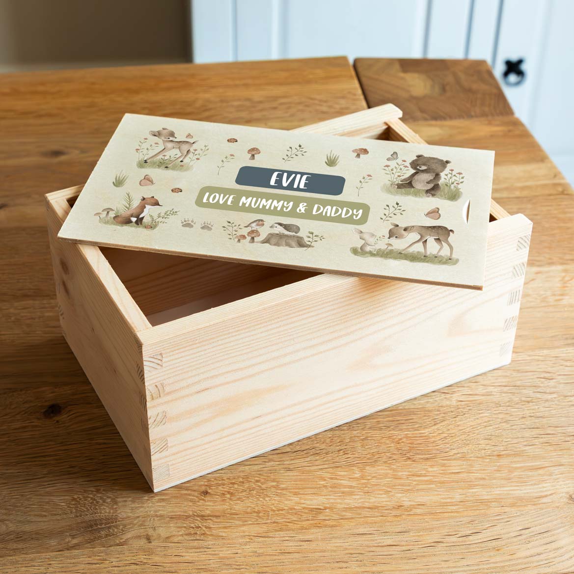 Wooden keepsake box with woodland animal illustrations and personalised text.