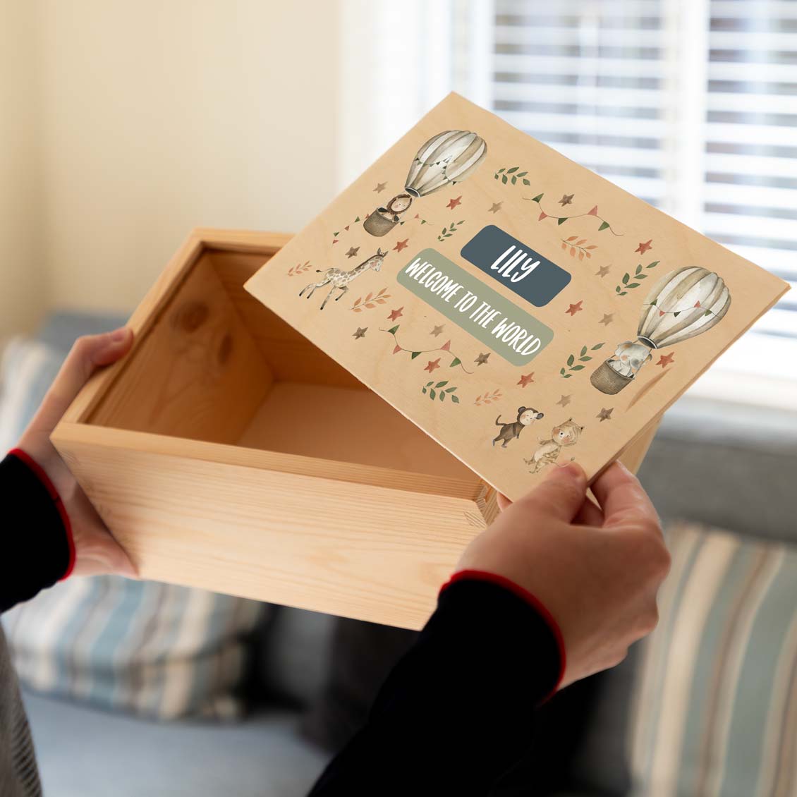 Wooden keepsake box with a safari animal design and personalised text to celebrate a new baby.