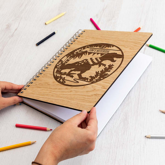 Personalised wooden notebook with a laser-engraved dinosaur design