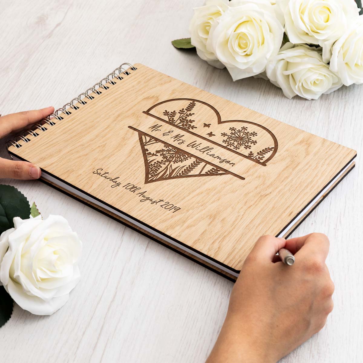Wedding guest book with laser-engraved heart design and personalisation A4 landscape