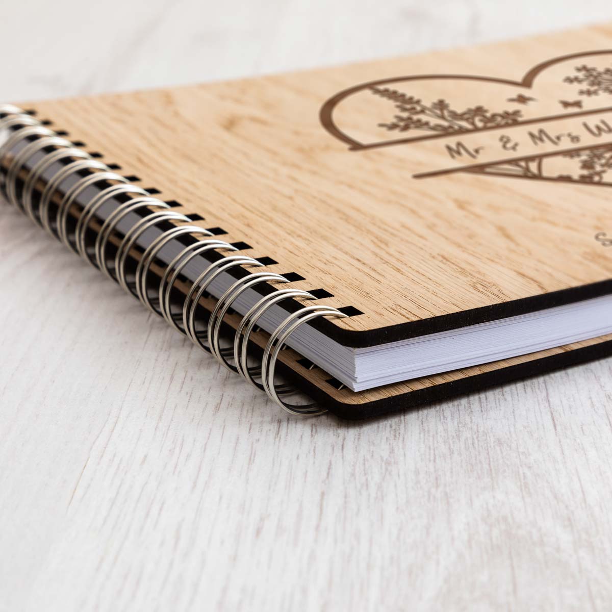 Close up of oak veneer cover of wedding guest book