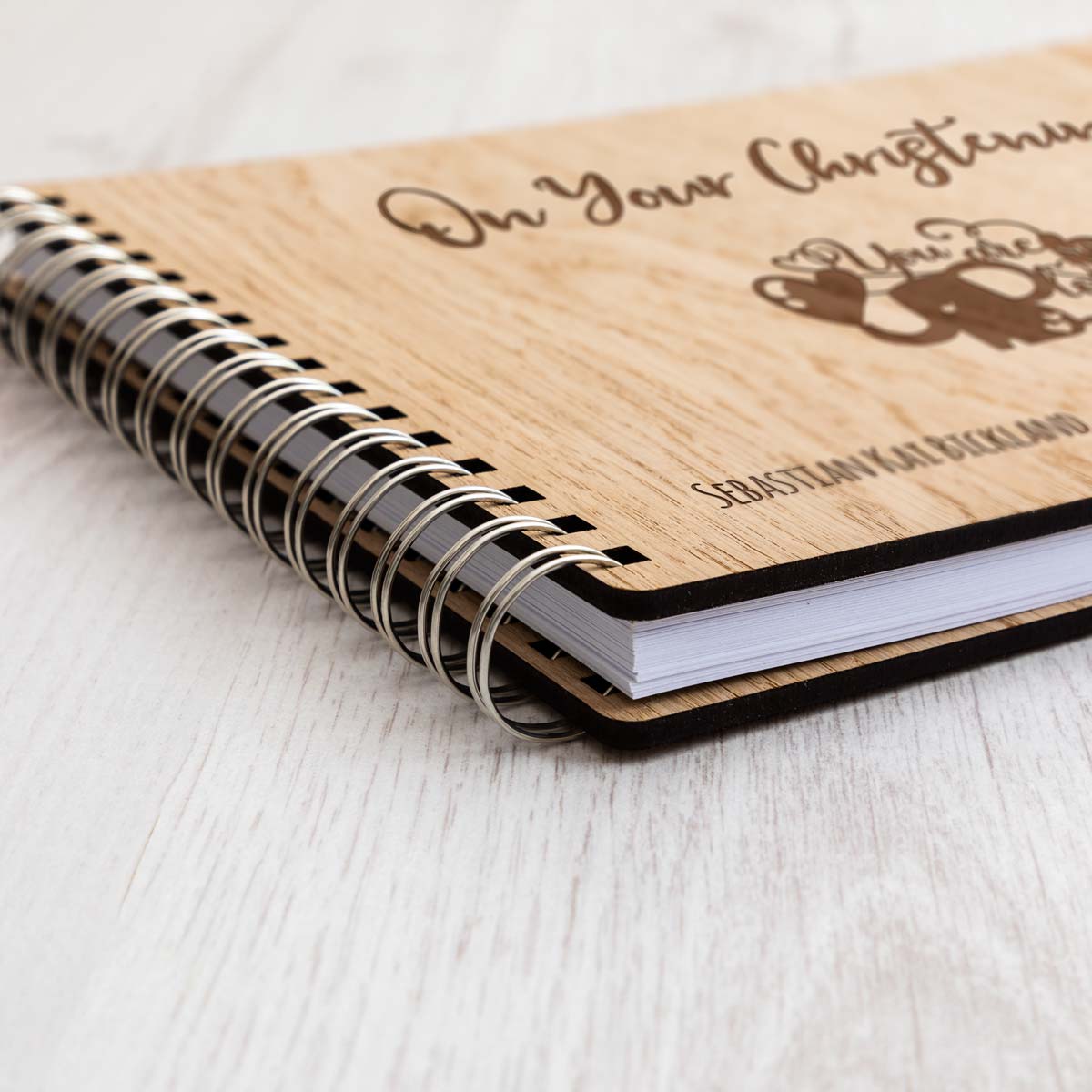 Close up of Christening guest book oak veneer covers