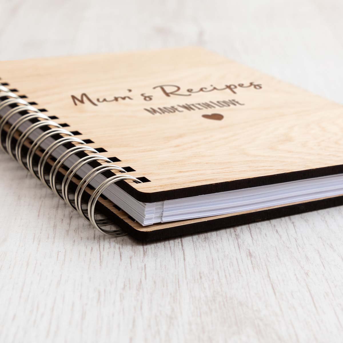 Close up of recipe notebook with oak veneer covers