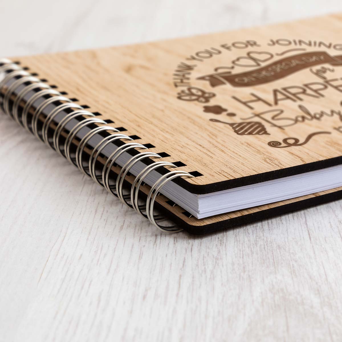 Close up of baby shower guest book oak veneer cover