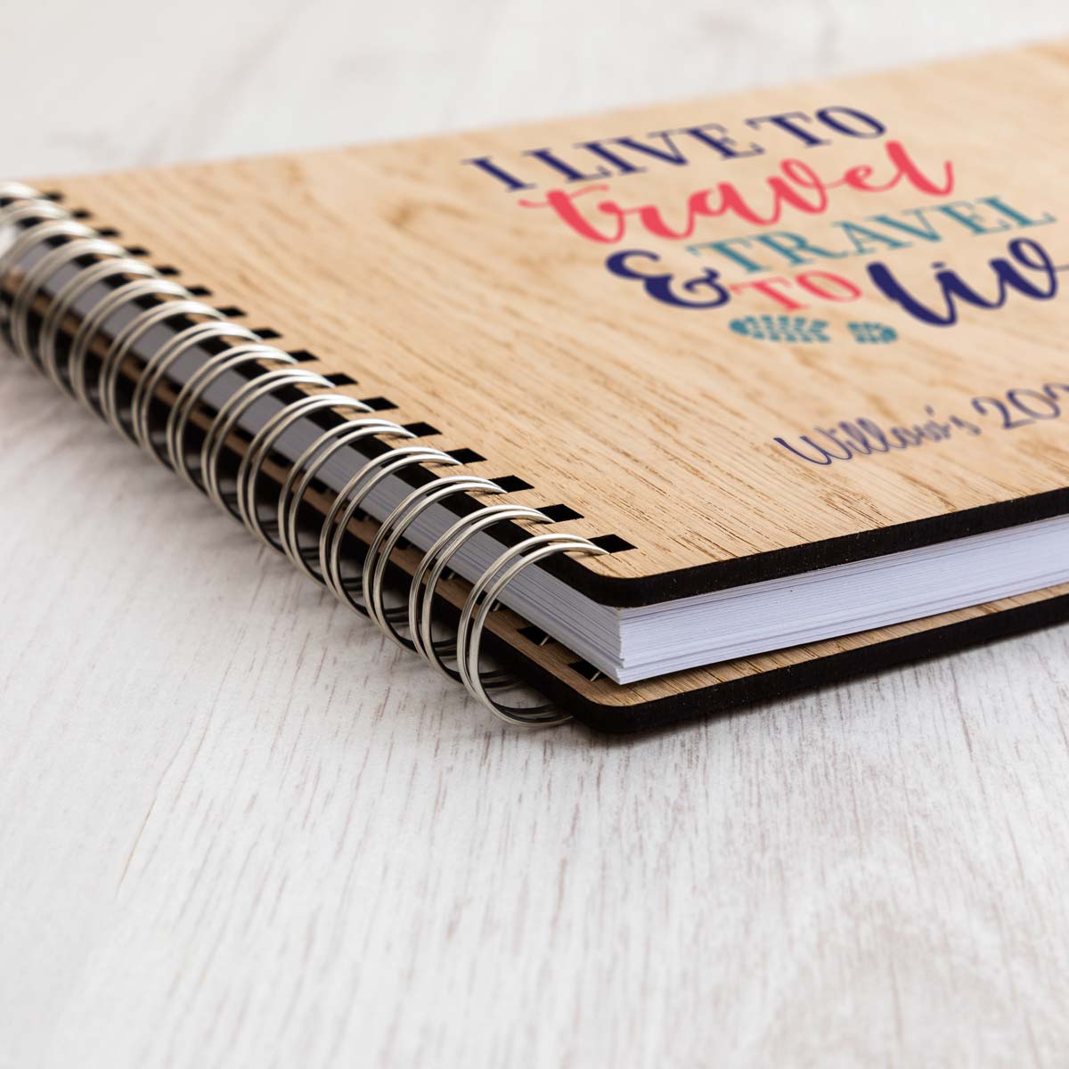 Close up of wooden travel planner notebook