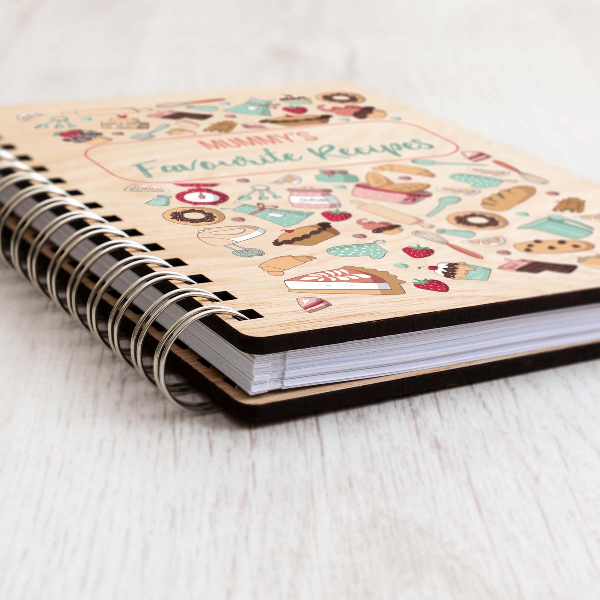 Close up of baking recipe book with oak veneer covers