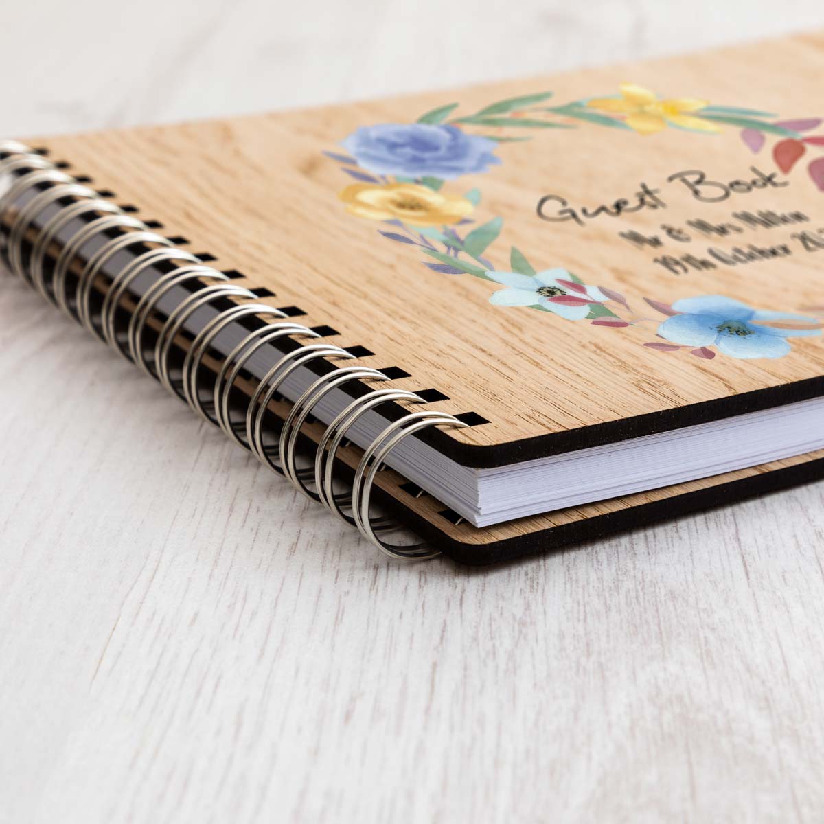 Close up of wedding guest book oak veneer cover