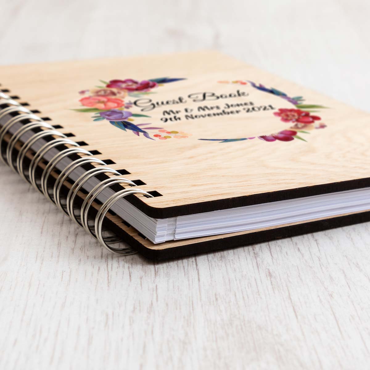 Close up of wedding guest book oak veneer covers