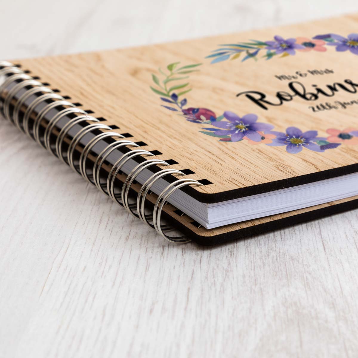 Close up of wedding guest book oak veneer covers