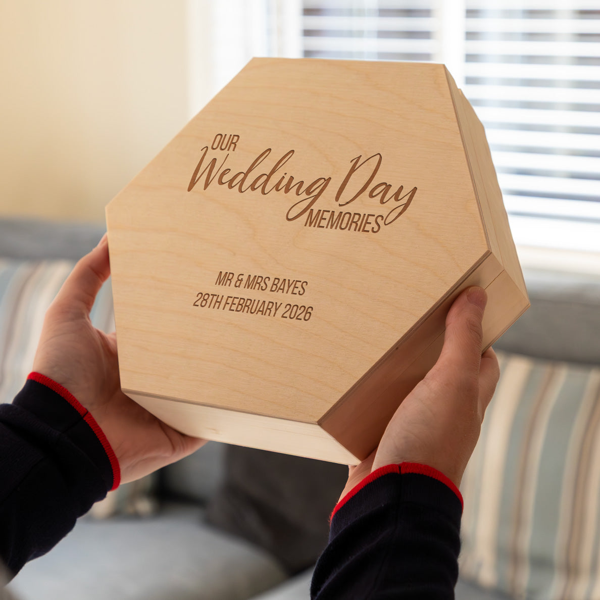 Hexagonal wooden keepsake box for wedding day memories, engraved with personalised names and wedding date. 