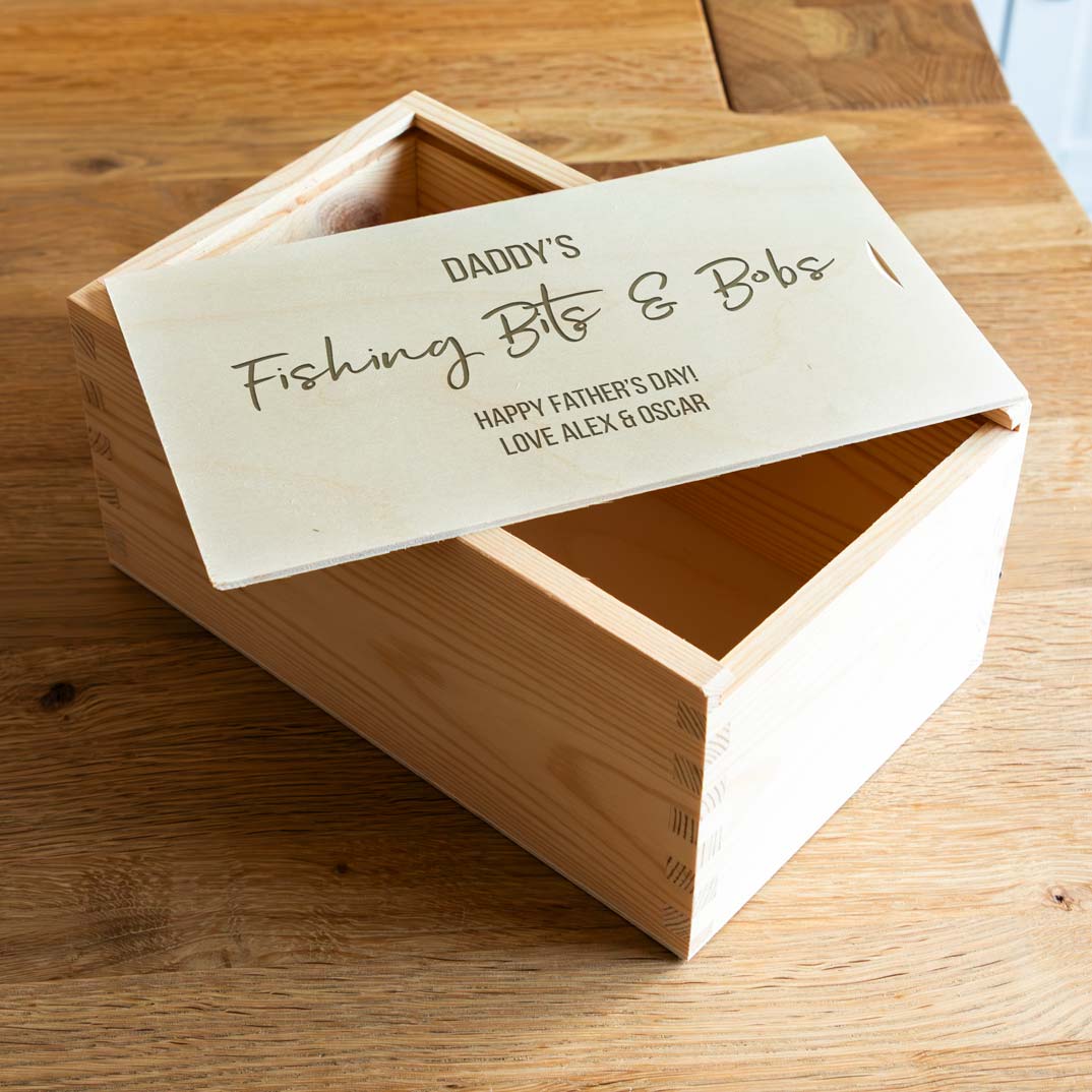 Wooden fishing tackle box with engraved personalised message.