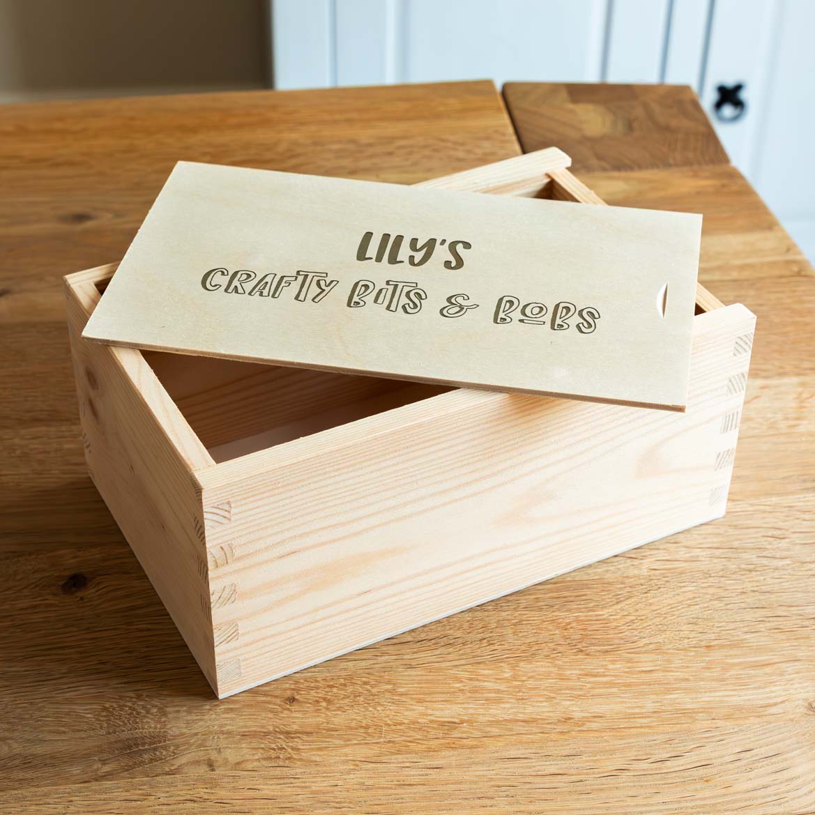 Wooden craft box with a laser-engraved lid that is personalised with any text.