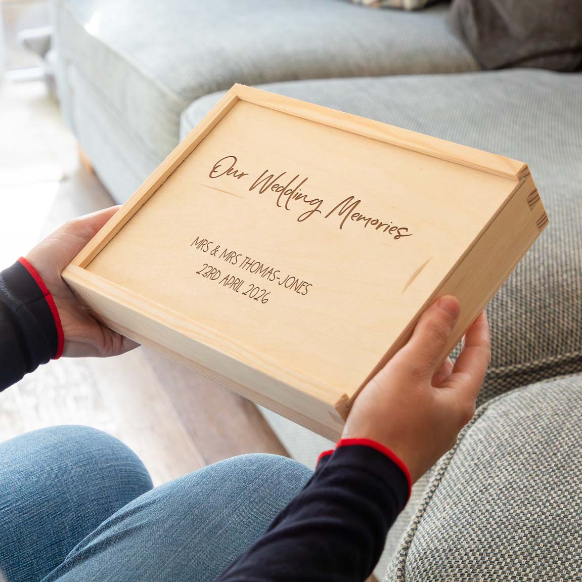 Wooden photo box wedding gift that is laser engraved with 'Our Wedding Memories' and the personalised names and date.