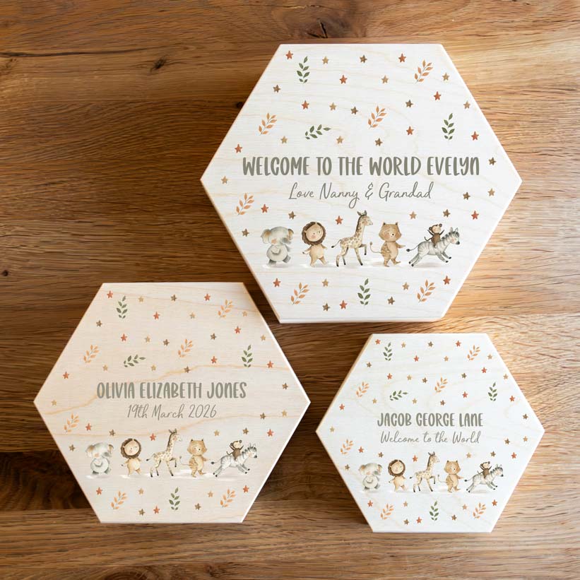 Three hexagonal keepsake boxes in sizes small, medium and large, printed with personalised text and jungle animal designs.