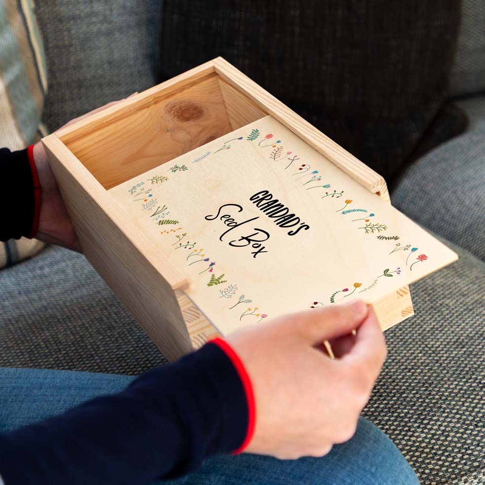 Wooden seed box with a sliding lid, personalised with any text and printed with a wildflower design.