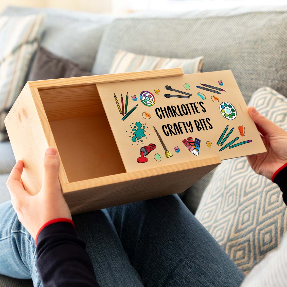 Wooden craft box and sliding lid printed with colourful illustrations and personalised text.