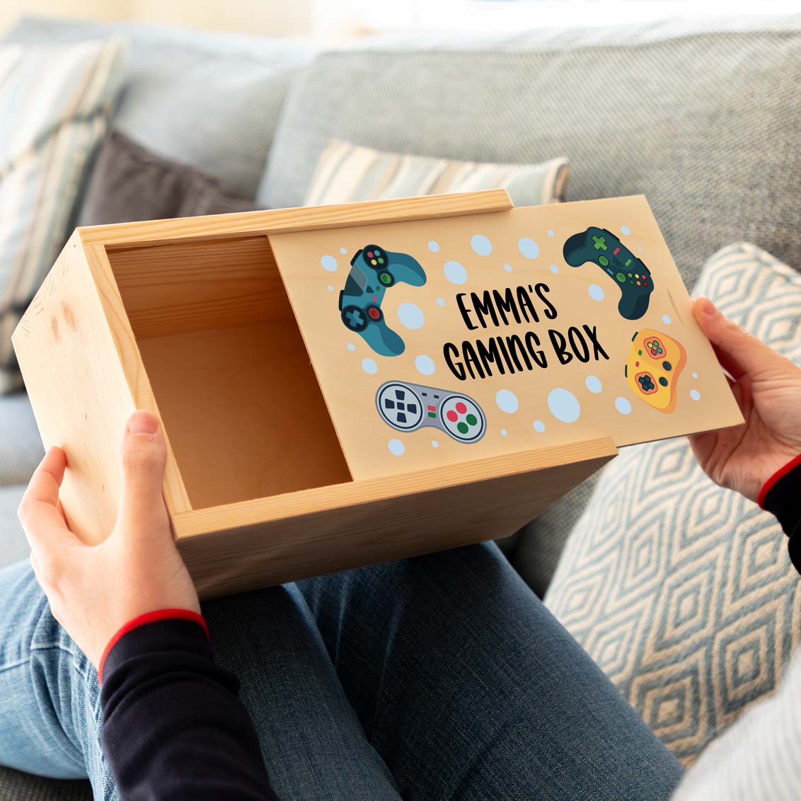 Wooden gaming box with sliding lid printed with a personalised gaming controller design.