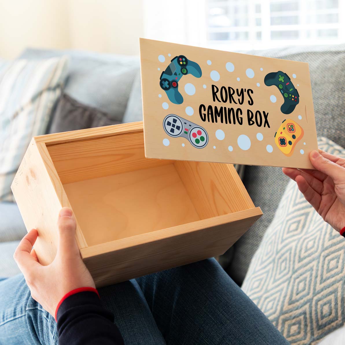 Wooden gaming box printed with personalised text and gaming-themed illustrations.
