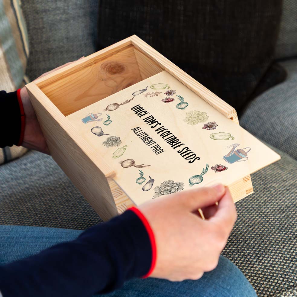Wooden seed box with vegetable illustrations and personalised text.