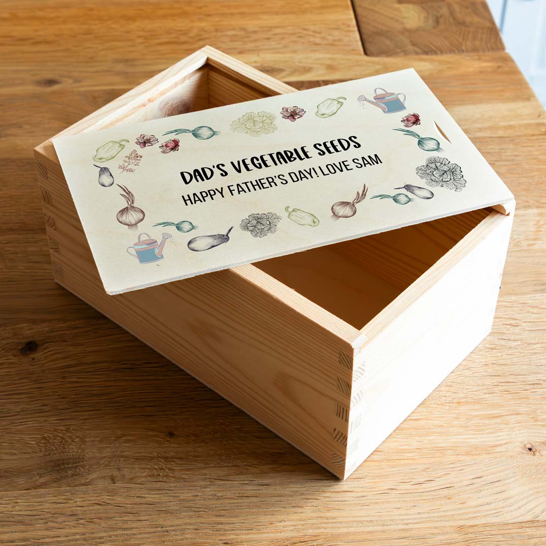 Wooden seed box with vegetable design and personalised text.