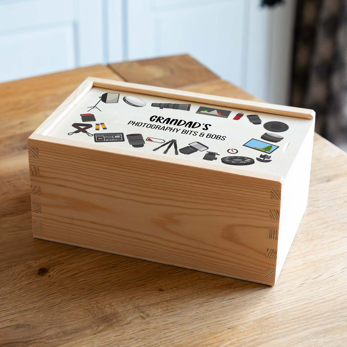 Wooden box with 'Grandad's Photography Bits & Bobs' on a wooden surface.