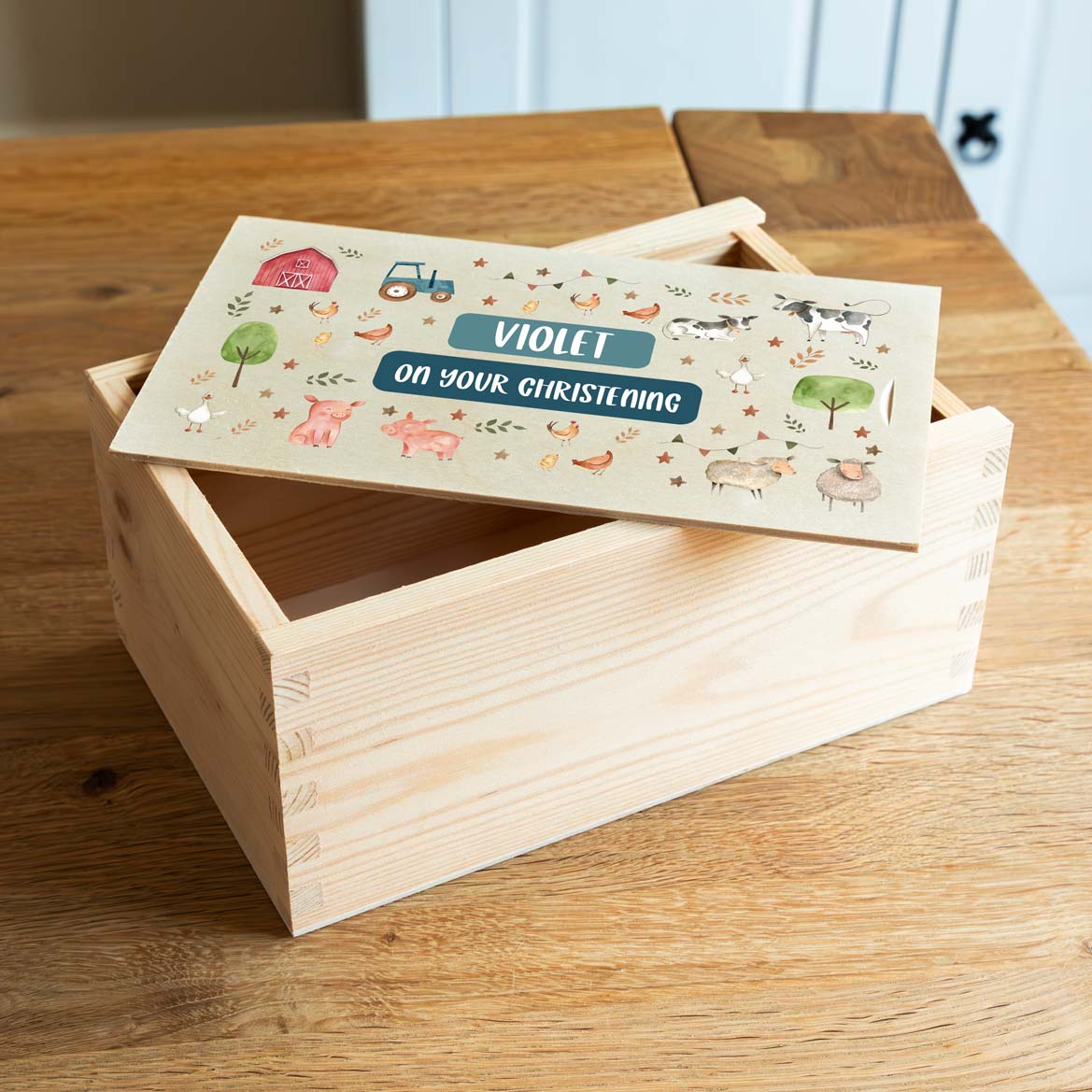 Wooden Christening keepsake box with farm animal illustrations and personalised name and text.