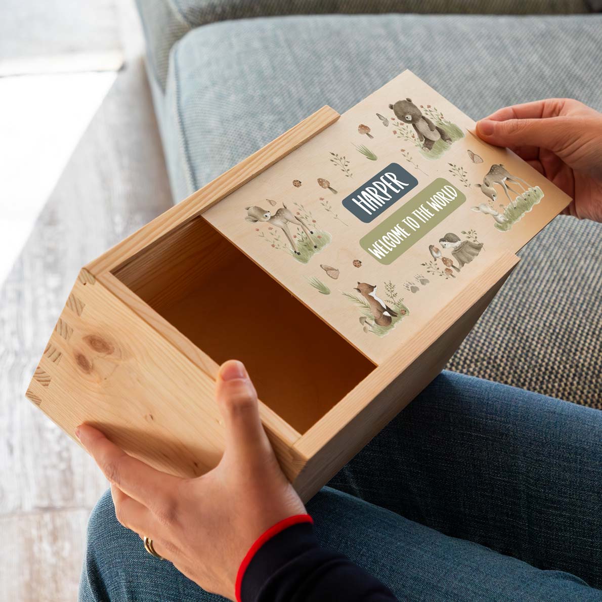 Wooden keepsake box with forest animal illustrations and personalised text to celebrate a new baby.